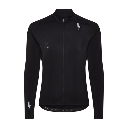 A-studio-photograph-of-a-fitted-long-sleeve-black-cycling-jersey-against-a- white-background-The-jersey-features- a-full-black-zipper-a-high-collar-and-an-extended-drop-tail hem-It-has-several-reflective-light-gray-logo-a- lightning-bolt-graphic-on-the-right- chest-the-brand-name-"LUCA"-on-the- left-chest-and-a-smaller-lightning-bolt- graphic-on-the-left-wrist-cuff-The- image-highlights-the-technical-design-minimalist- branding-and-reflective-elements-of-the-garment